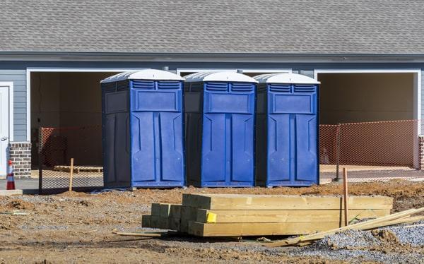 Portable toilet on an active construction job site